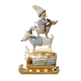Figurine de Noël Enfant sur renne Pastel